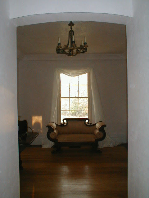 Interior — completed plaster walls and classical trim detail